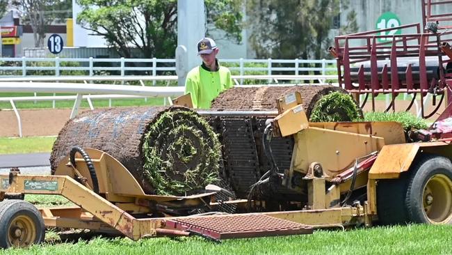 Work underway last week to remove the poisoned section of track at the Gold Coast Turf Club and replace it before the Magic Millions, which was subsequently washed out. Picture: Supplied