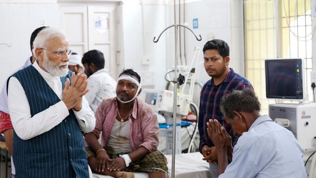 India's Prime Minister Narendra Modi visiting a hospital to meet the victims of a three-train collision. Picture: AFP