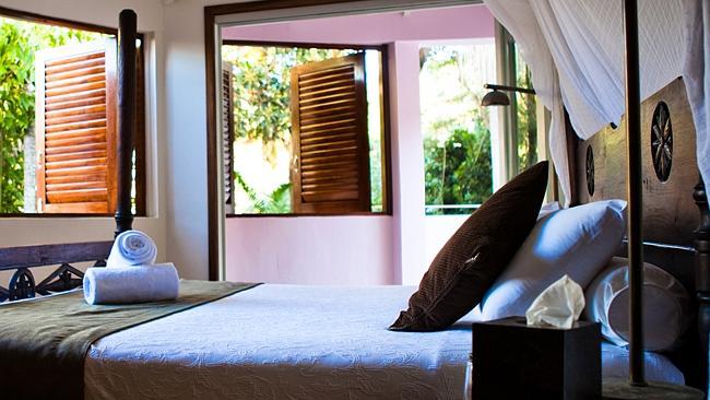 Rae’s on Wategos’ penthouse has ocean views and Balinese-style comforts.  