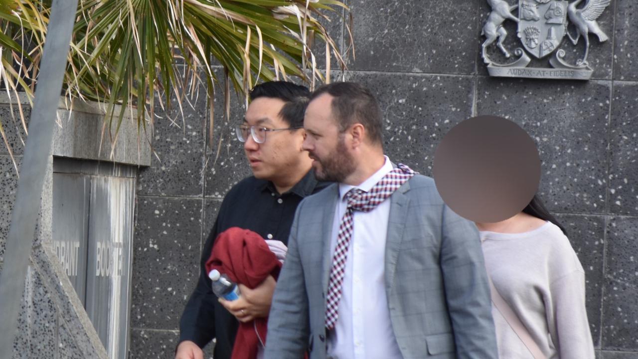 Lim Fang leaving the Toowoomba Courthouse with his lawyer Shane McDowell after pleading guilty to secretly filming women in bathrooms.