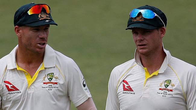 David Warner (left) and Steve Smith are only allowed to play grade cricket under the terms of their 12 month bans. Picture: AFP