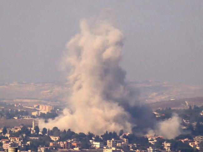 Smoke rises from the site of an Israeli airstrike that targeted the southern Lebanese village of Kfar Tibnit on October 13. Picture: AFP