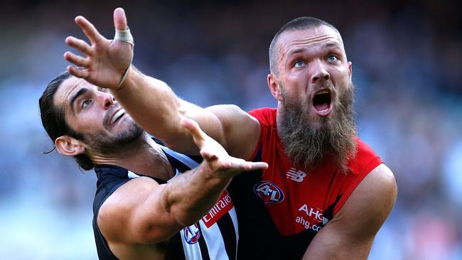 Melbourne’s Max Gawn and Collingwood’s Brodie Grundy compete in a ruck contest at the Melbourne Cricket Ground.  Picture: Adam Trafford/Getty