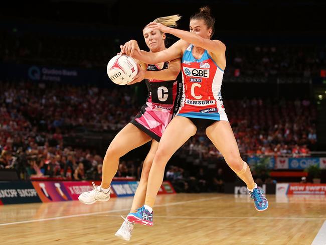 Maddy Proud of the Swifts goes shoulder to shoulder with Adelaide’s Gia Abernethy.