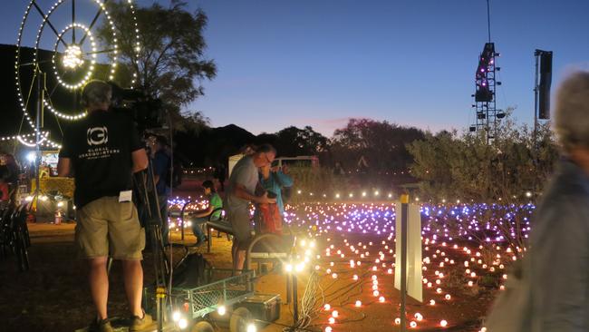 Lights illuminated the park as the sun set on Alice Springs.