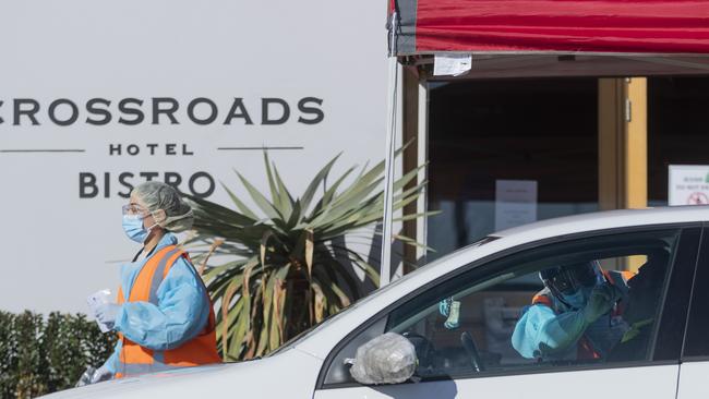 COVID-19 testing is carried out at the Crossroads Hotel in Sydney yesterday. Photo: Brook Mitchell.