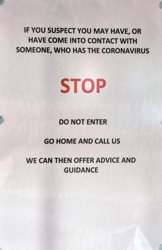 Signs warning patients about the 2019-nCoV strain of the novel coronavirus, are pictured at The County Oak Medical Centre in Brighton, Southern England. Picture: Glyn Kirk/AFP