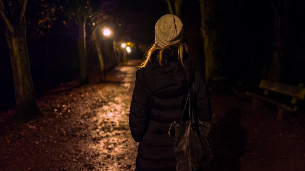 woman walking alone at night