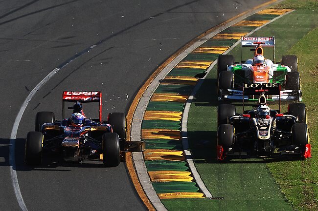 Daniel Ricciardo (left) got into trouble on the first lap, but managed to get into the points with a ninth-place finish. (Photo by Mark Thompson/Getty Images)