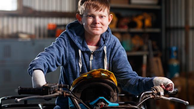 John Hutchins is justifiably super proud of the work he has done restoring his quad bike with some help from some people at his school. Picture Matt Turner.