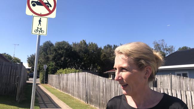 Thornlands NDIS provider Sara Horsey near a laneway to the Crystal Waters Shopping Centre, where a tobacco shop was torched in May. Pictures; Judith Kerr