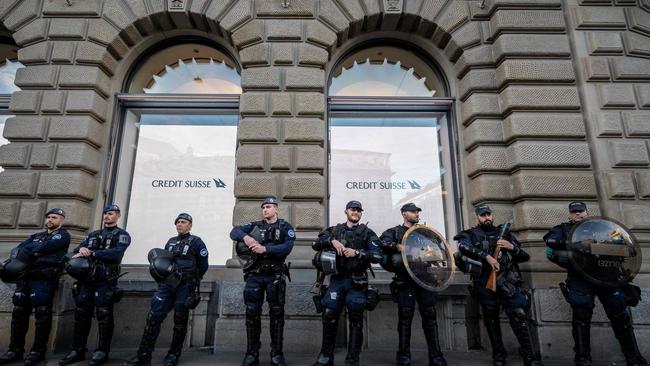 Riot police officers take position in front of the headquarters of Credit Suisse bank. Picture: AFP