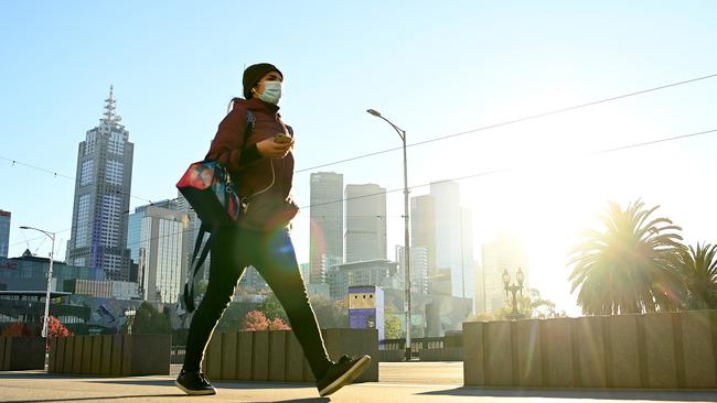 A lone pedestrian walks along Princes Bridge in Melbourne. Picture: Getty Images