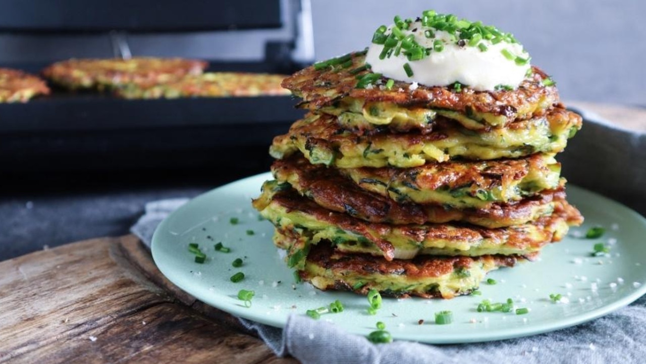 How to make delicious zucchini fritters in a sandwich press. Picture: Tristan Lutze