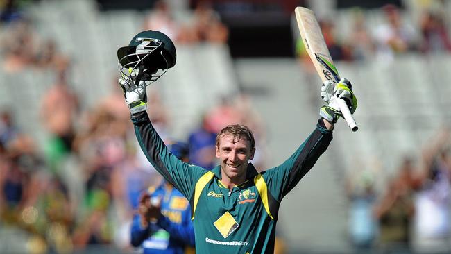 Australian cricketer Philip Hughes celebrates reaching his 1st century in ODI on debut Pic. AAP/Joe Castro