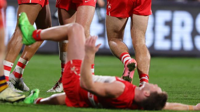 ADELAIDE, AUSTRALIA - JUNE 15: Joel Amartey of the Swans celebrates a goal with team mates including Hayden McLean while Taylor Adams of the Swans gets pushed by Mitchell Hinge of the Crows and gets a free kick infront of goal during the 2024 AFL Round 14 match between the Adelaide Crows and the Sydney Swans at Adelaide Oval on June 15, 2024 in Adelaide, Australia. (Photo by Sarah Reed/AFL Photos via Getty Images)