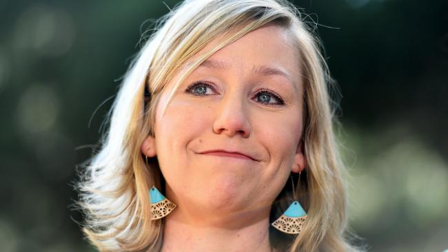 Greens Senator Larissa Waters reacts as she announces her resignation as a result of her dual Australian-Canadian citizenship.