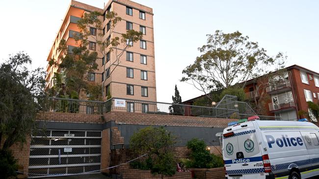 A police van secures the perimeter of the apartment block. Picture: NCA NewsWire / Jeremy Piper