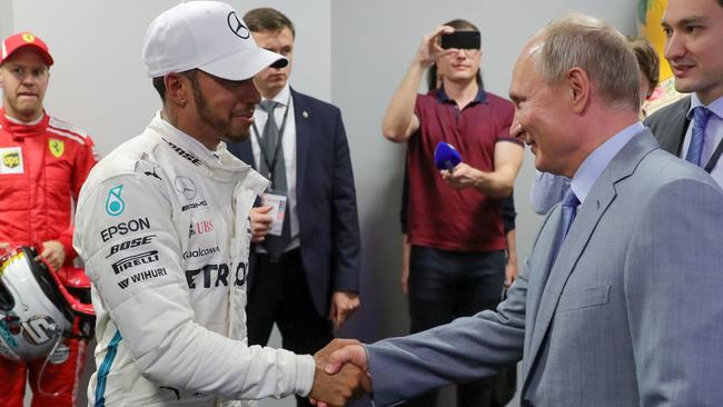 Shaking hands with Russia President Vladimir Putin after winning the Russian Grand Prix in 2018. Photo by Mikhail Klimentyev / AFP