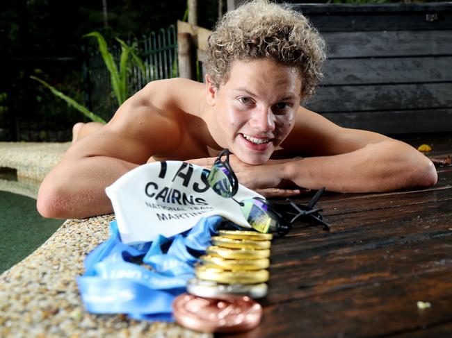 Ike Martinez and his swag of gold medals at the national swimming championships. Picture: Stewart McLean