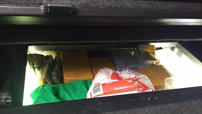 A 33-year-old Wamberal man was arrested at a carpark on Wyong Road, Tuggerah, about 12.45pm on June 4. During a search of his vehicle, officers located 1kg of cocaine, 4kg of MDMA and $100,000 in a hidden compartment. Picture: NSW Police