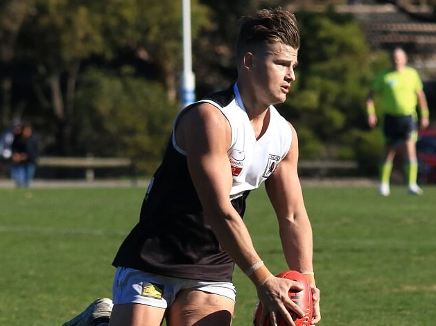 Mitch Jackson sends Ringwood into attack. Picture: Davis Harrigan