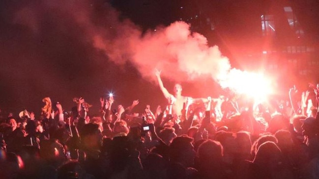 Fans celebrate Australia's win in Federation Square. Picture: NCA NewsWire/David Crosling