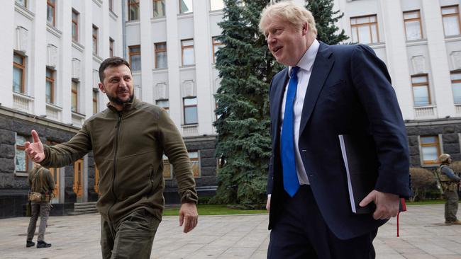 Ukrainian President Volodymyr Zelensky (L) welcoming British Prime Minister Boris Johnson ahead of their meeting in Kyiv. (Photo by Stringer / UKRAINIAN PRESIDENTIAL PRESS SERVICE / AFP)