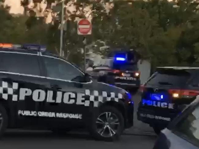 Screenshot of a video of police on the scene at Central Park in Hawthorn, where teens were arrested for public drunkeness. Picture: Supplied (Tabitha)