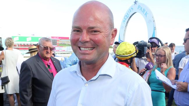 Gold Coast Turf Club race meeting, featuring two major lead in races to the Magic Millions.Photo of race 7. Photo of winner number 9 SNOW VALLEY. Jockey is Robbie Fradd, trainer is Matthew Dunn (pictured).Photo by Richard Gosling