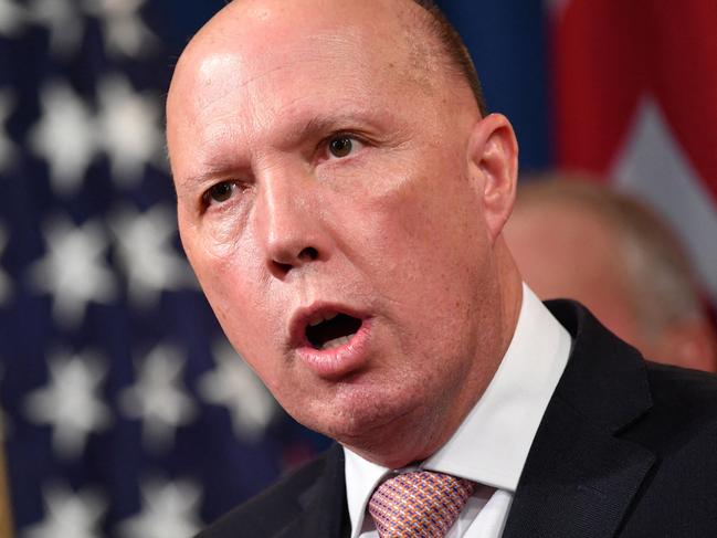 (FILES) A file photo taken on March 5, 2020 shows Australia's then-Home Affairs Minister Peter Dutton during a press conference at the Department of Justice in Washington, DC. - Dutton, who became Australia's new defence minister on March 29, 2021, is a hardline ex-cop who has overseen a controversial refugee policy, riled close ally New Zealand by deporting criminal Kiwis and publicly clashed with the Chinese government. (Photo by Mandel NGAN / AFP)