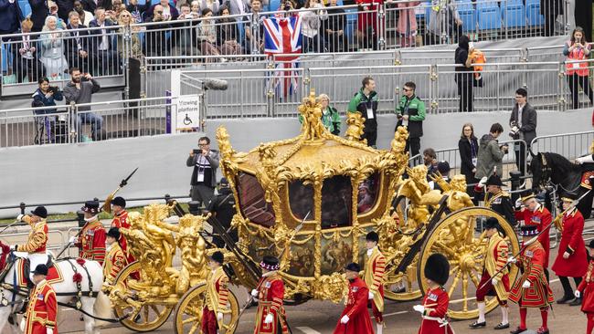 AFTER: The original golden coronation carriage with a hologram of the Queen is seen during the Platinum Pageant. Picture: Getty Images.