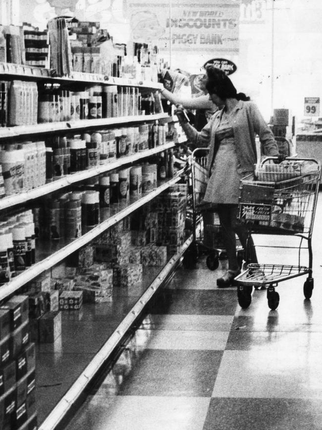 A shopper browsing a Coles New World in 1973.