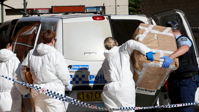 POLICE investigating the death of a woman whose body was found in a wheelie bin at the back of a unit complex in Freshwater are not treating the death as suspicious. Picture: Toby Zerna