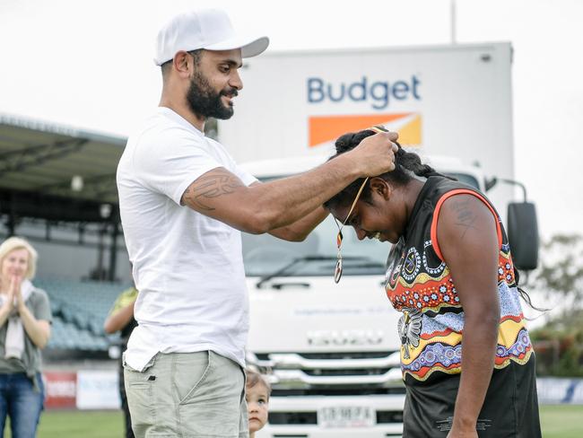 Jessica Stassi being presented with the Maggie Varcoe medal by Maggie’s twin brother, Adam. Picture: AAP/Morgan Sette