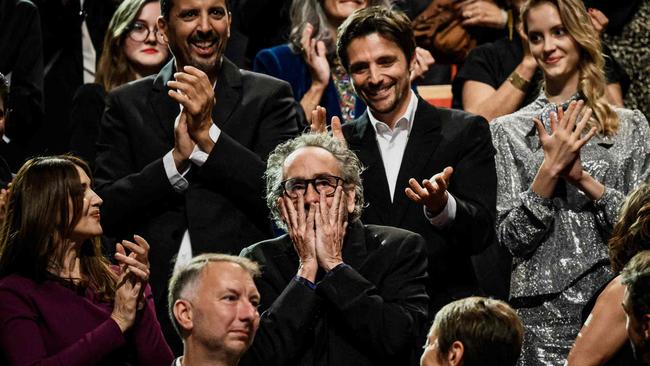 Tim Burton learning he has received the lifetime achievement award. Picture: Jeff Pachoud/AFP