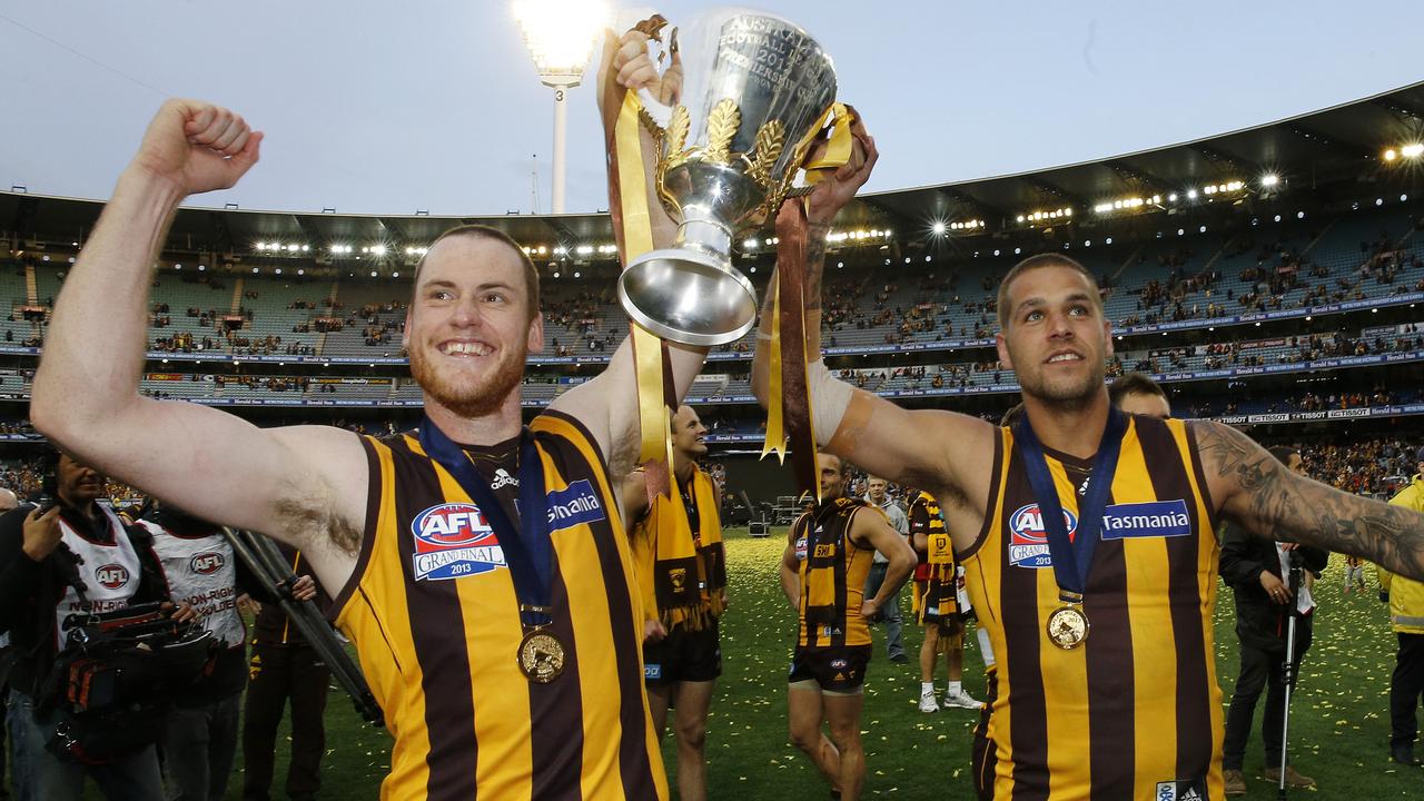 Jarryd Roughead and Lance Franklin with the premiership cup after the 2013 Grand Final.