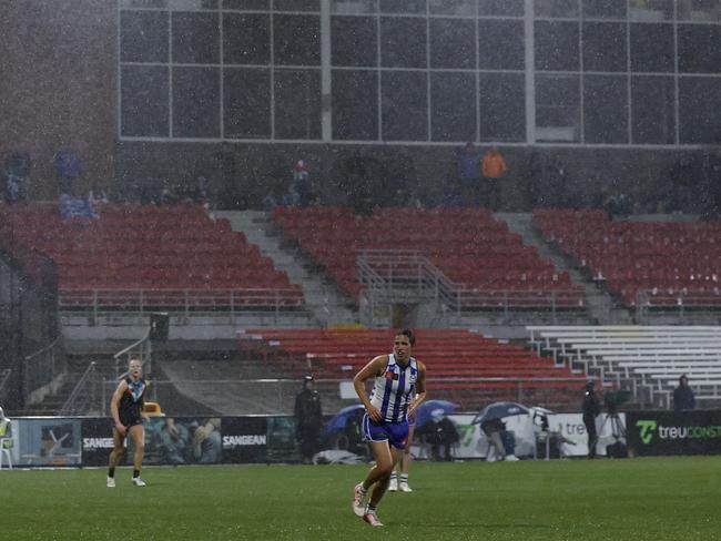 Less than 1000 people attended the game between North Melbourne and Port Adelaide at 5pm on a Friday night in the pouring rain. Picture: Daniel Pockett/AFL Photos/via Getty Images.