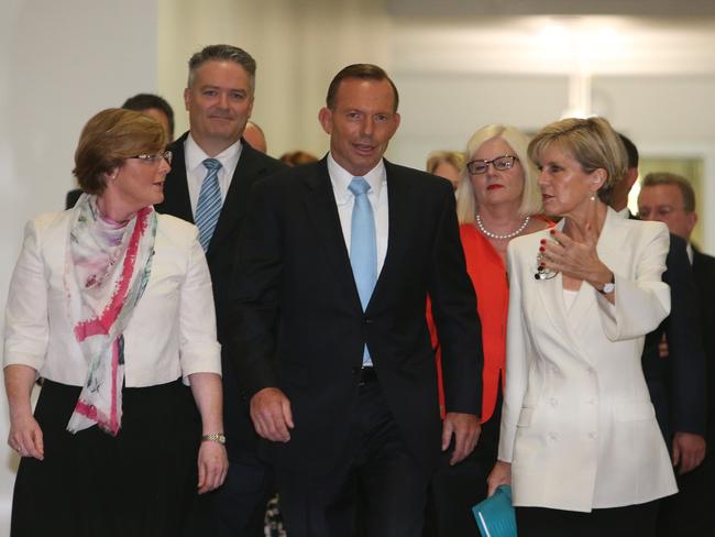 The ‘group corridor walk’ became a common visual motif during leadership meetings. Here, Prime Minister Tony Abbott walks with supporters including Julie Bishop (right) before the leadership spill meeting, February 9, 2015.