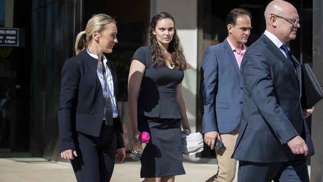 Lead investigator Detective Sergeant Nicola Brown (left) and Dreamworld ride operator Chloe Brix (second from left) are seen leaving the inquest into the Dreamworld disaster at the Southport Courthouse. (AAP Image/Glenn Hunt)