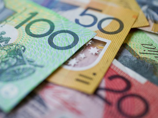 Australian money background showing $100, $50 and $20 notes with a shallow depth of field.