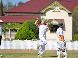 John Cleary on the way to taking four wickets for Warwick Hotel Colts in the preliminary final at Slade Park. Picture: Gerard Walsh