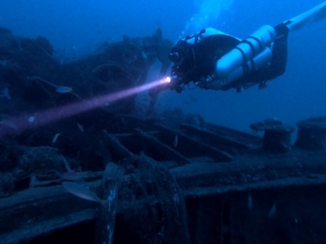 Dive Centre Manly divers exploring the New Crane Barge shipwreck also off the northern beaches, near Newport, where they saved another shark caught in nets this week. Picture: Stephen Ho.