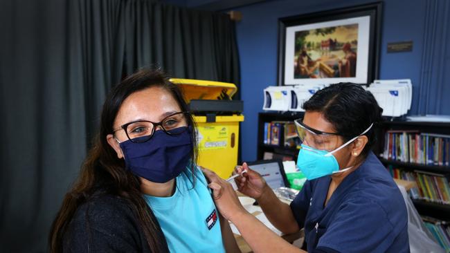 A NSW Health worker administers a Pfizer Covid-19 vaccine. Picture: Lisa Maree Williams/Getty Images