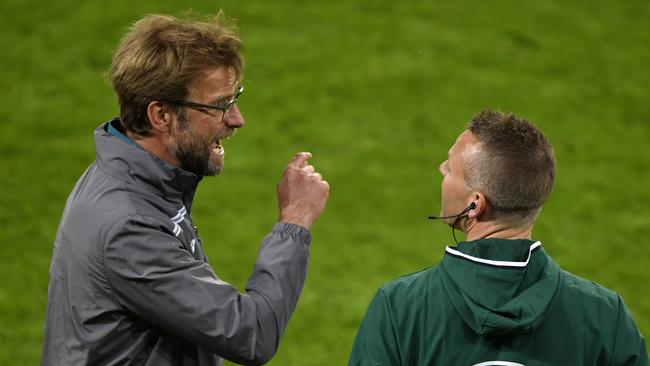 Liverpool's German head coach Jurgen Klopp (L) reacts.