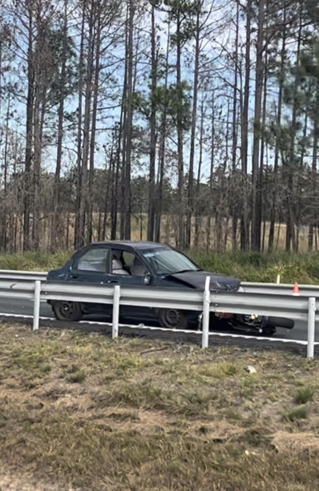 A motorcycle rider is fighting for life after a collision with a car on the Bruce Highway.