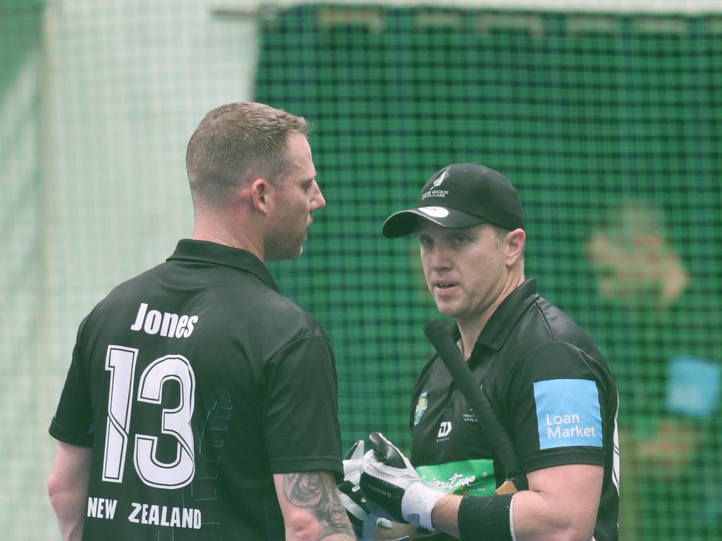 The Trans Tasman trophy for indoor cricket is being played on the Gold Coast at Ashmore. Australia v New Zealand Mens 40s . Kiwi batters Scott Jones and Luke Woods hold a mid pitch crisis meeting. Picture Glenn Hampson