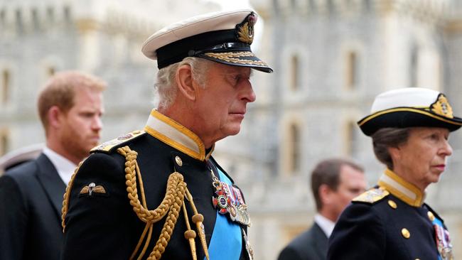 Prince Harry, King Charles III (centre) and Princess Anne follow Queen Elizabeth II’s coffin as it arrives at the late queen’s committal service at St George's Chapel inside Windsor Castle in September. Picture: AFP