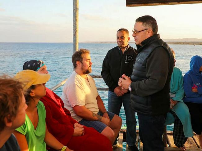 Red Sea governor Amr Hanafi speaking to survivors rescued from a capsized vessel in the Red Sea harbour town of Marsa Alam. Picture: EGYPTIAN SIS / AFP