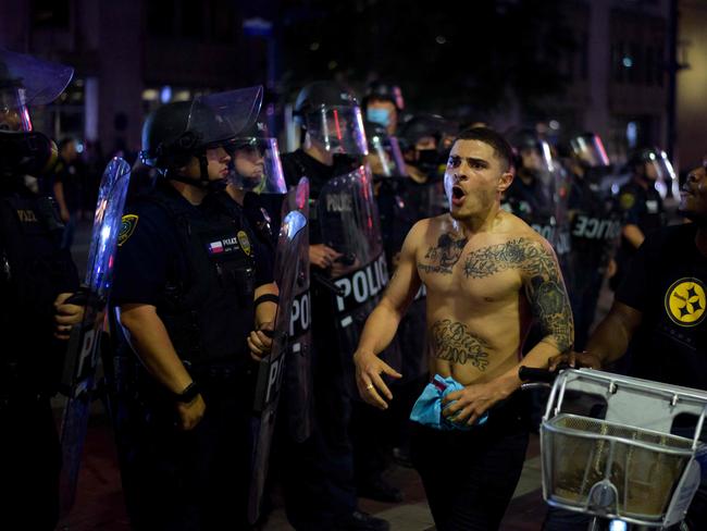 A protester confronts a row of police officers during a "Justice 4 George Floyd" demonstration in Houston, Texas. Picture: AFP